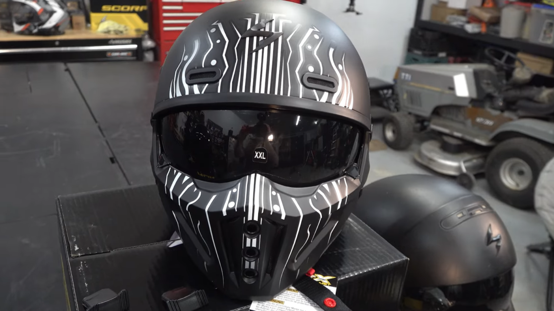 scorpion exo helmet on black table in the garage