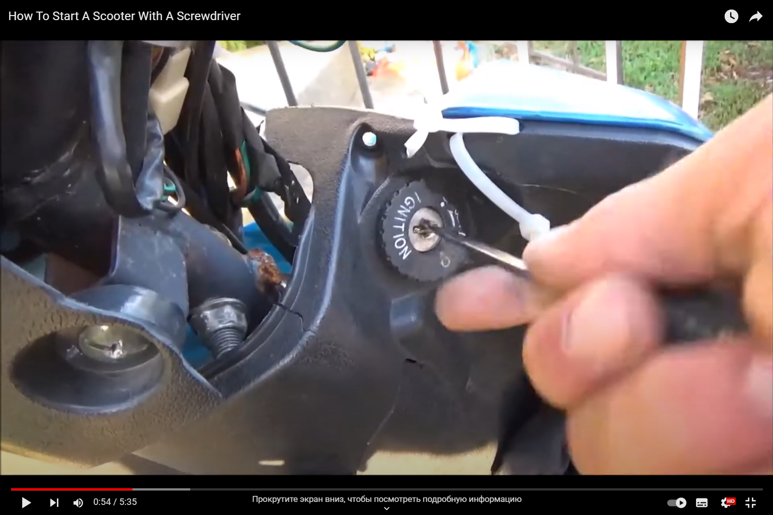 Screwdriver in the hand that turns on the motorcycle